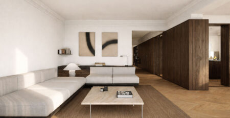 Parquet en espiga de madera natural en el salón de una vivienda reformada en la calle Muntaner de Barcelona